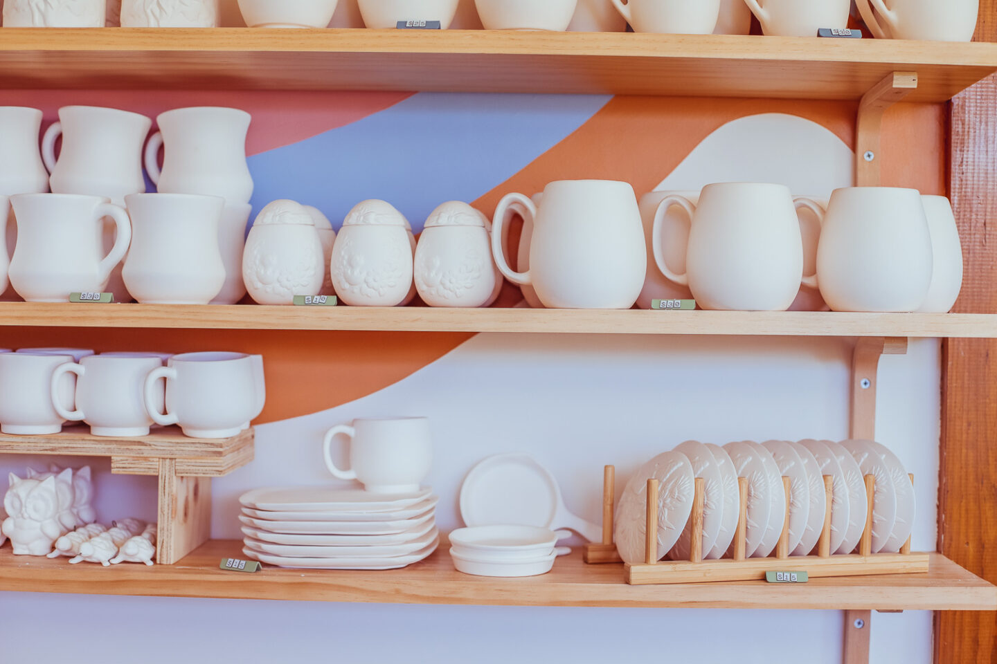 Ceramic pieces on their shelves ready to pick